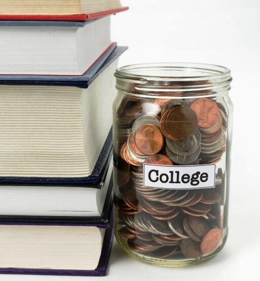 Understand Financial Aid Definitions -Stack of books and jar of money