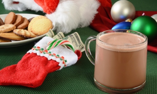 Christmas Stocking filled with money on table | Give a Financial Gift