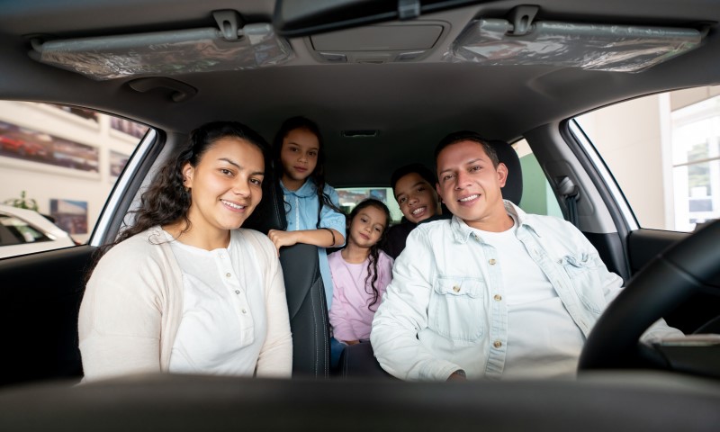 END-OF-YEAR CAR BUYING IS A GREAT TIME | Family inside new auto purchase