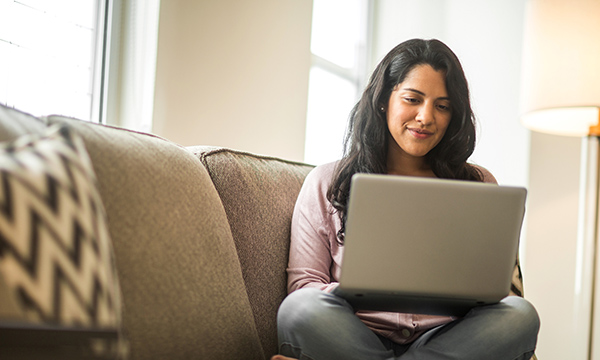 Woman using a laptop at home