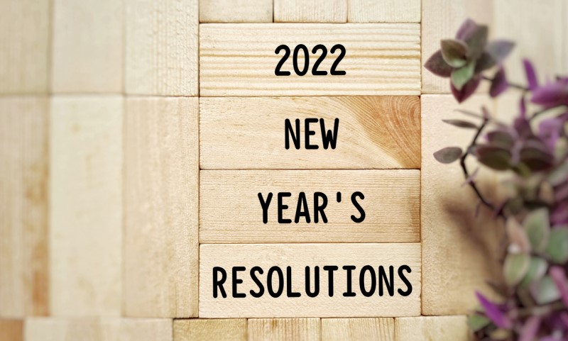 Financial New Year resolutions that are bound to stick | Wood blocks with title "2022 New Year's Resolutions"