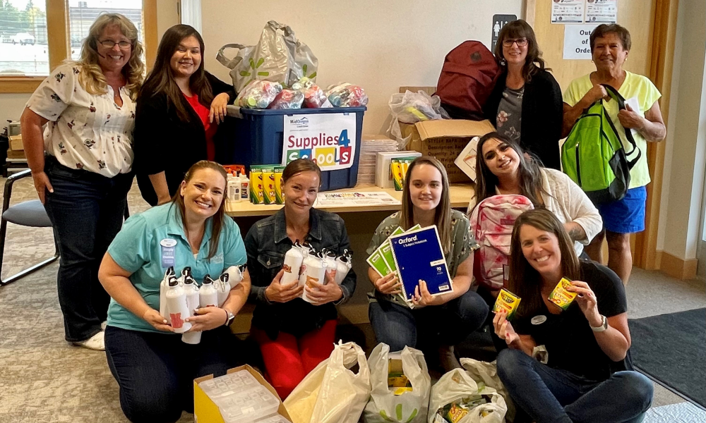 Supplies 4 Schools Completed Successfully | Madras Branch staff and member with donated school supplies